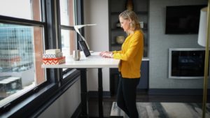 Woman Using one of the Best Standing Desks