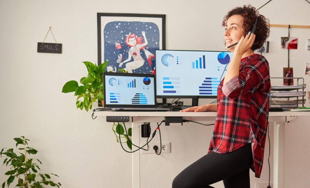 Woman Using One of the Best Adjustable Desks